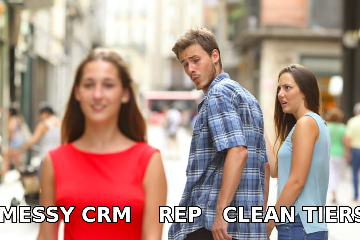 Rep walking past a messy CRM toward a clean tiered list